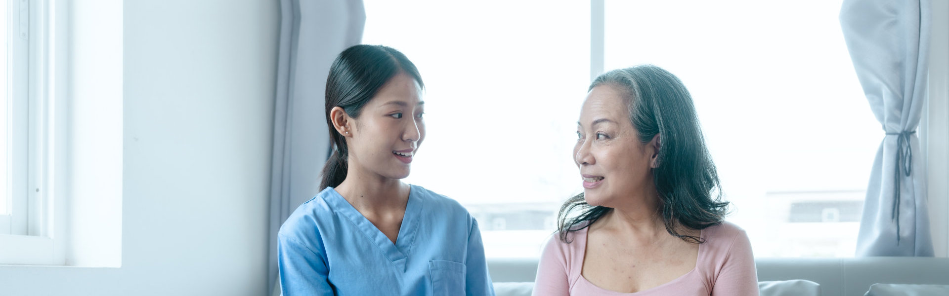 Caregiver talking to elderly